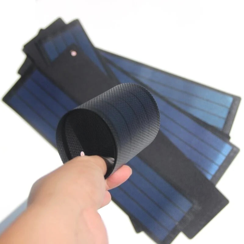 Flexible amorphous solar module gently rolled in a hand