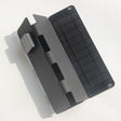 Black four-fold panel partly closed