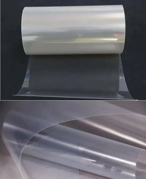 PET solar panel backsheet roll partly unrolled on a dark background