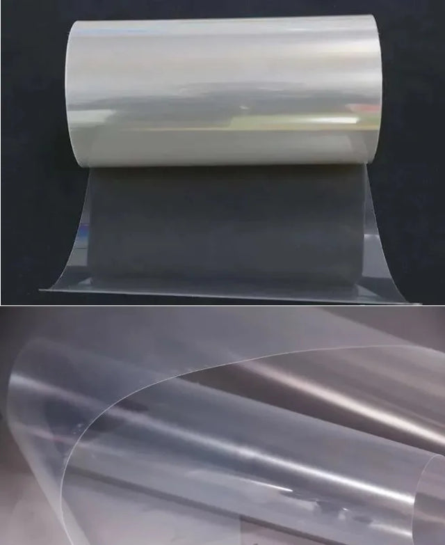 PET solar panel backsheet roll partly unrolled on a dark background