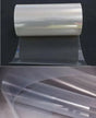 PET solar panel backsheet roll partly unrolled on a dark background