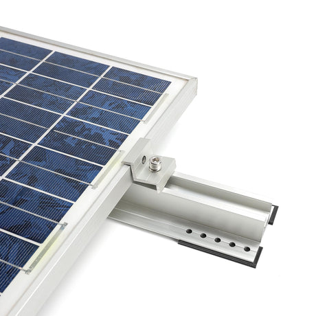 Framed module clamped to trapezoidal mini rail; end clamp attached.