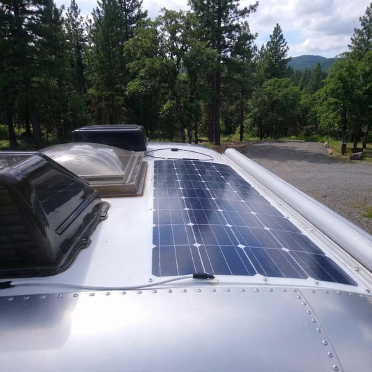 flexible solar panels adhered to RV aluminum roof for lightweight off grid power
