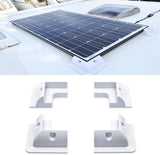 White solar panel corner mounts supporting a framed module on an RV roof