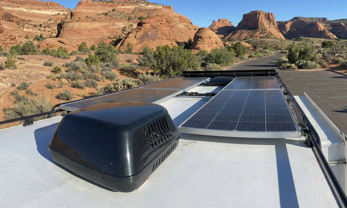 rigid solar panels mounted on RV roof in desert canyon setting
