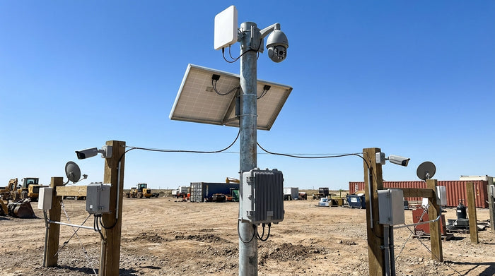 Pole-mount solar power kit with shared battery and 4G router feeding multiple security cameras on a remote site