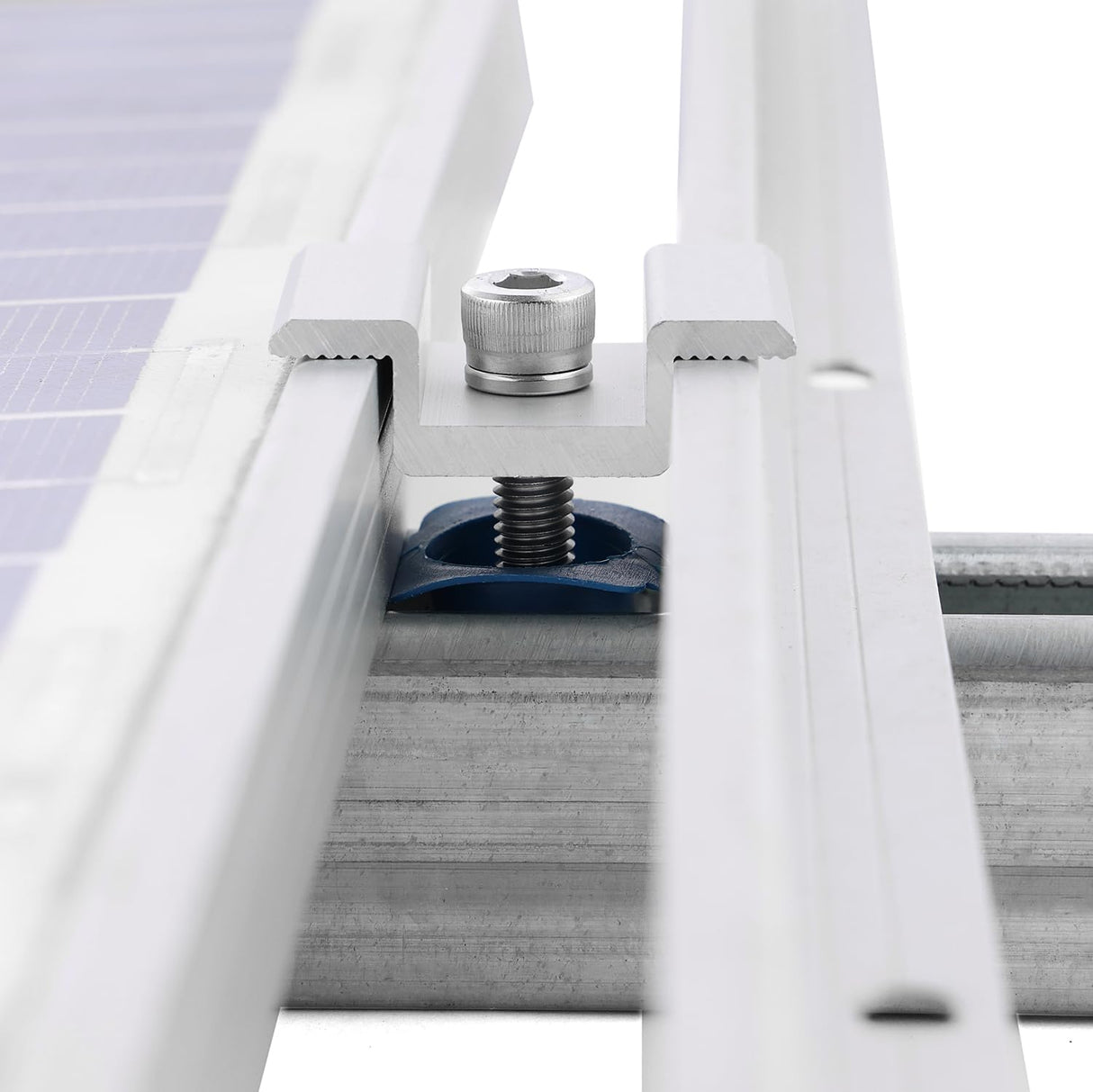 Silver solar panel mid clamp securing two framed modules to strut channel