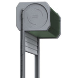 Side close-up of the green coop door roller housing and shutter guide