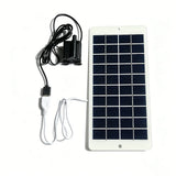 Black USB water pump connected to the white solar panel