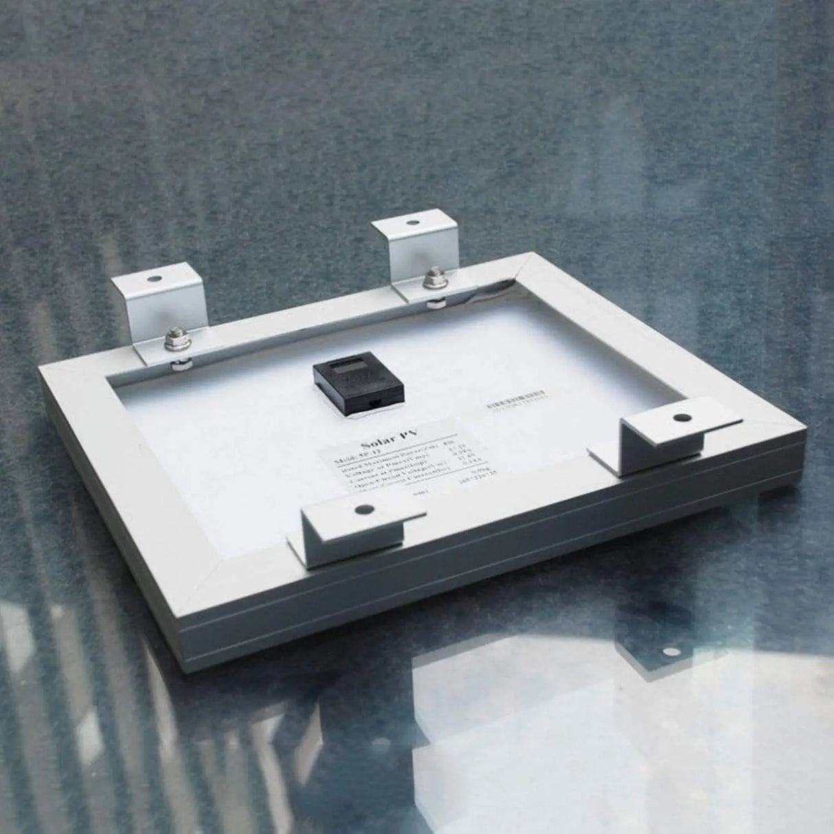 Solar panel back with aluminum Z brackets positioned at the corners