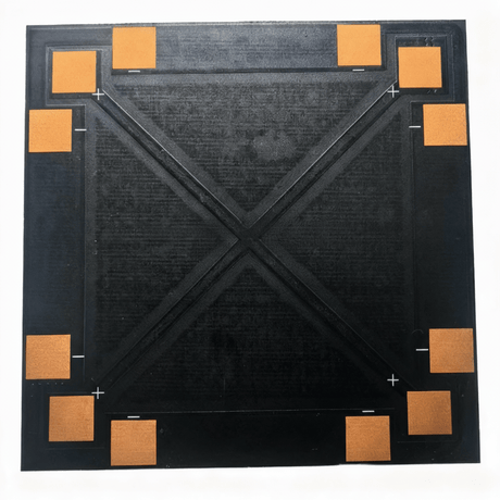Back of panel with eight copper pads around the edges and PCB “X” stiffener.